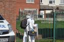 Forensics officers in Horsforth after a woman's death