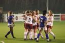 (Team embracing) the team celebrate the first goal by Hope Knight during the tough match. Photo: Alex Daniel