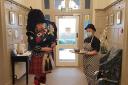 Piper Paula Bowes pipes in the haggis at Springbank Care Home, Silsden