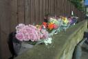 Floral tributes left at the scene of a crash on Bradford Road, Birstall, where a man died