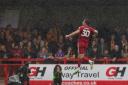 Will Wright jumps for joy after scoring Crawley's winner