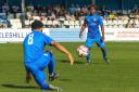 Talent Ndlovu (facing the camera) scored for Eccleshill in their 3-2 win over Rossington Main.