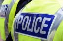 A man been arrested on suspicion of robbery in an incident following a car crash in Huddersfield