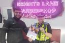 Barber Abbas Hussain and PCSO Clapperton are highlighting a 'Cut It Out' campaign aimed at tackling domestic abuse.