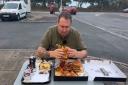 Danny Malin tests one of the burgers from the box