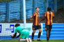 Cole Roberts (centre) impressed for the Bantams in a friendly against Eccleshill last season, but is now banging in goals for the Eagles instead.