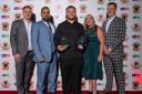 Bradford College staff Chris Cullimore, Furkan Uddin, Becky Walsh and Asher Nutting with award-winning Bulls prop Ebon Scurr, centre.
Pics: Bradford College