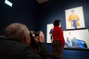 A painting of pop star Harry Styles by David Hockney has gone on display at the National Portrait Gallery as part of a new exhibition dedicated to the artist (Jordan Pettitt/PA)