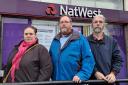 Councillor Aislin Naylor (Lib Dem, Idle and Thackley), Councillor Brendan Stubbs (Lib Dem, Eccleshill), and Councillor Alun Griffiths (Lib Dem, Idle and Thackley) outside the NatWest bank in New Line, Greengates which is set to close early next year