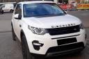 The white Land Rover Discovery