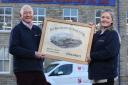 Wyedean Weaving father-and-daughter team, managing director Robin Wright and systems project manager Susannah Walbank, with the original artist’s impression of the Bridgehouse Mill complex