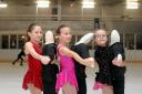 Freya Harkan, Gracie-Mae Scott and Poppy-Rose Scott with ‘partners’ at Bradford Ice Arena in 2011