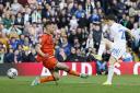 Dan James grabs Leeds' vital second goal against Millwall yesterday, with the win sending the hosts top of the Championship table.