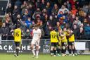 A stunned City section look on as Harrogate enjoy their third goal