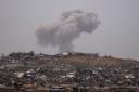 Smoke rises in the sky after an explosion in the Gaza Strip as seen from southern Israel (Leo Correa/AP)