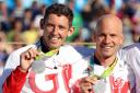 Great Britain's David Florence (left) and Richard Hounslow with their silver medals for the Canoe Slalom C2 Men's Double at the Whitewater Stadium on the sixth day of the Rio Olympic Games, Brazil. PRESS ASSOCIATION Photo. Picture date: Thursday A