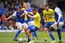 Ipswich Town's Cole Skuse, left, and Leeds United's Kemar Roofe during the former side's 3-2 in the Sky Bet Championship match at Portman Road