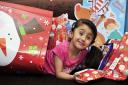 DELIGHTED: Rehannah Hussain, six, with some of the presents donated to her by schoolfriends and parents