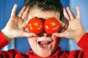 Mason Kerin, eight, with tomatoes