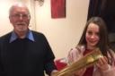 Mike Healey, pictured presenting the replica Olympic torch to East Bradford Cycling Club's Florence Greenhalgh, will be carrying the Queen's Baton later this month ahead of the Commonwealth Games.