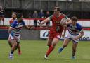 Matthew Bailey gets past the Rochdale defence during Cougars' 'invincible' season in 2022.