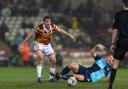 Sam Stubbs proves too strong for Wycombe striker Sam Vokes