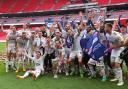 Crawley celebrate winning the League Two play-off final yesterday