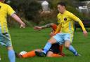 Wrose Bull player Adam Medley (yellow) will hope to shine at home to Shipley Town on Sunday Picture: Richard Leach