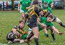 Wharfedale's Rob Baldwin gains ground against Hinckley despite taking a hand to the face. Picture: Ro Burridge