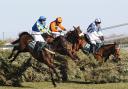 Ryan Mania and Aurora's Encore, left, on their way to victory at the 2013 Grand National. Pic: PA