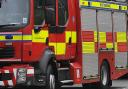 Two pumps were called to the scene of a car fire which spread to a house in Drighlington