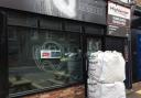 Two large sandbags have been placed at the entrance to the barbershop in Bishopthorpe Road  Picture: Mike Laycock
