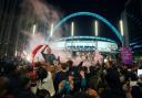 England fans celebrate outside Wembley after reaching the final. Picture: Zac Goodwin/PA Wire