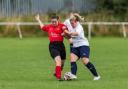 Tyersal’s Nikki Relton (in red) and Skipton Town’s Corina Riley vie for the ball in their re-arranged friendly, courtesy of H Baker Photography