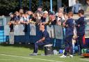 Marcus Bignot (sat down) watches on as his Guiseley side beat Gloucester City 2-1 for their first National League North win of the season. Picture: Alex Daniel.