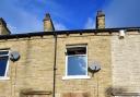 Cannabis plants were stacked outside a fire at Bradford home this morning