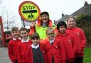 School crossing patrol Betty Timbrell, who is retiring at the age of 88, with pupils at Eldwick Primary School