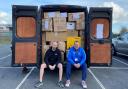 From left, Stephen Gilroy, from House of Wine, and Adam Thirsk, of the Bradford City Community Foundation, get ready for their road trip to deliver Ukraine aid donated by Bradford residents