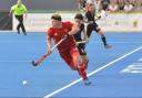Matthew Ramshaw (red) in action. Picture: England Hockey.