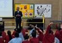 Cllr Mohammed Shafiq speaks to students at Killinghall Primary School