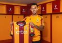 Dion Pereira shows off his City shirt after returning for a second loan spell