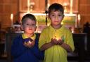 Wilsden siblings Rex and Rory Earley lit a candle for Queen Elizabeth II at St Saviours church in Harden.
