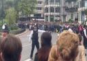 Huge crowds surge past police in attempt to get glimpse of Queen's funeral procession. Image: SWNS