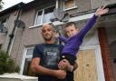 Karl Smith and his five year old son Jaden outside the gas explosion-hit property on Rathmell Street, Bradford