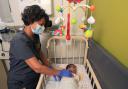 Dr Sunita Seal, consultant neonatologist at Bradford Royal Infirmary’s neonatal intensive care unit, examining a baby on the unit in 2022