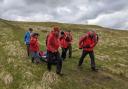 A fell runner with a suspected broken ankle is helped in the first of two calls to CRO yesterday