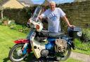 John Stanley, pictured, with the motorbike he was riding at the time of the collision
