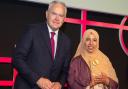 Salma Khatun receiving her Housing Heroes Tenant of the Year Award from BBC News presenter Huw Edwards
