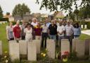 Members of the Bus to Bradford group paying their respects in France