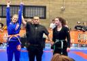 One of Gracie Barra's youngsters, Olivia, celebrates winning gold.